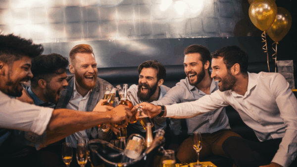 Fun Bachelor Party with BerlinActivities, saluting group of friends.