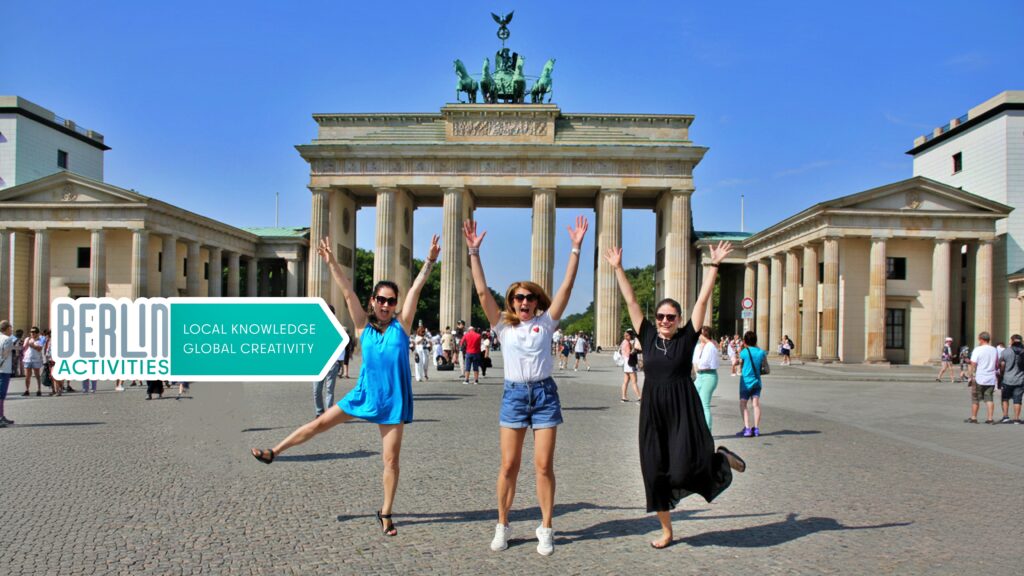 The FUN starts with US in Berlin! Our Team front of Brandenburg Gate. Local Knowledge and Global Creativity - Berlin Activities.
