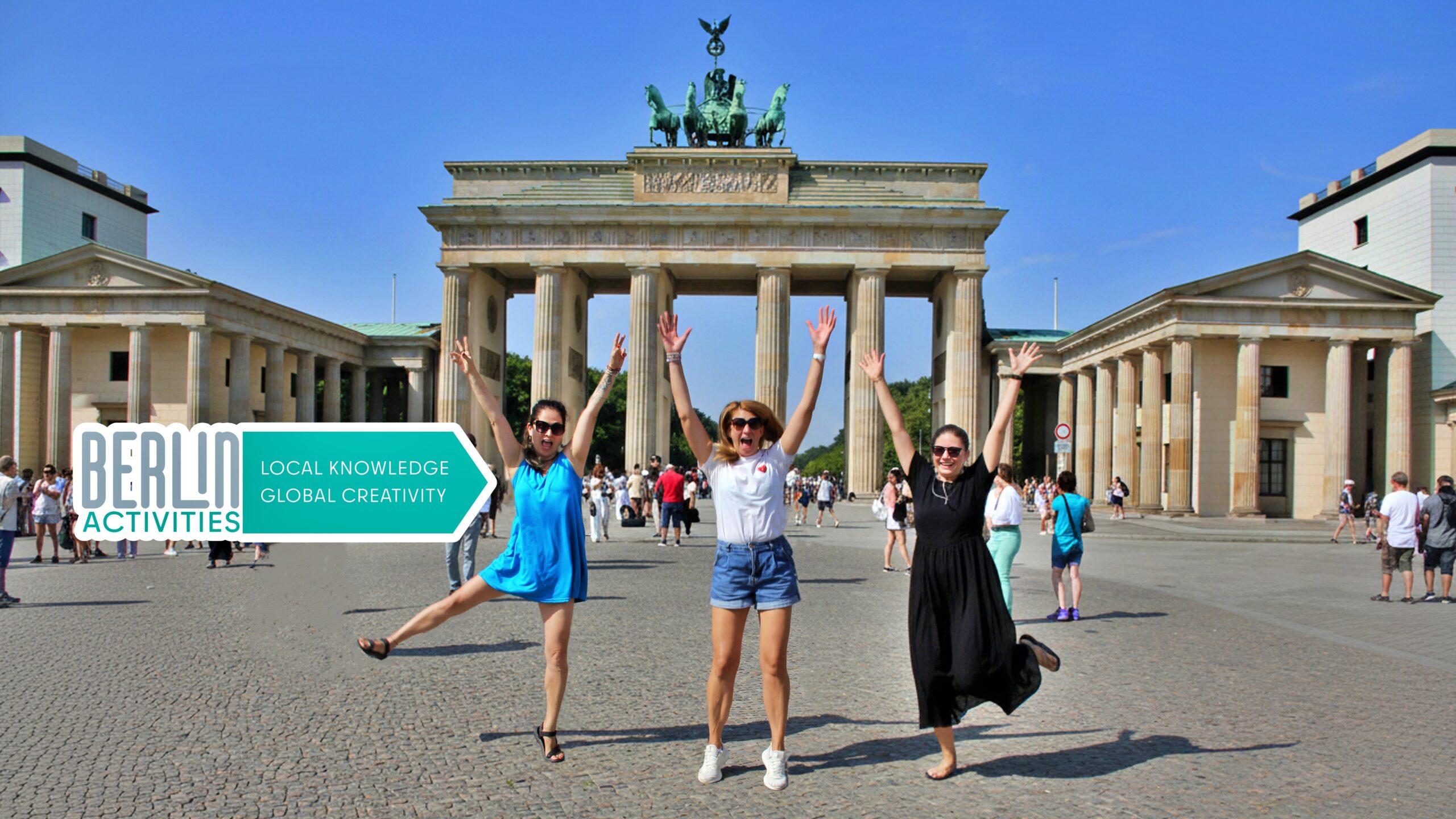 The FUN starts with US in Berlin! Our Team front of Brandenburg Gate. Local Knowledge and Global Creativity - Berlin Activities.